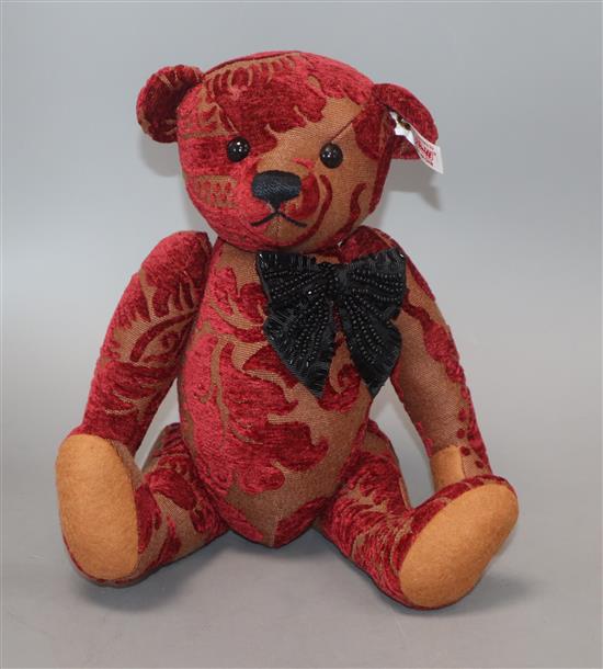 A Viktoria bear with white label box and certificate